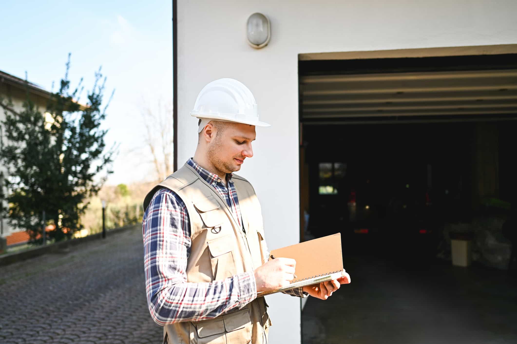 Man Inspecting Garage Door